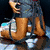 Animated sequence showing a person in blue top and dark shorts with red hair, transitioning from front to back view while adjusting clothing.