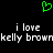 Green pixelated heart symbol above two lines of white pixelated text reading 'i love kelly brown' on black background.