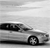 A grayscale image of a car with visible wheels and a side profile against a light background.