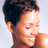 Static 48x48 pixel icon showing a close-up of a person's head and shoulders with dark hair, light skin tone, closed eyes, and a slight smile against a plain background.
