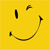 Yellow square background with black pixelated smiley face featuring vertical eye, curved eye, and wide curved mouth.