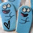 Blue cartoon character with large eyes and open mouth, holding a black heart symbol in multiple