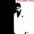 Pixelated static image of a figure with dark hair and beard wearing a white robe against a black and white background with red pixelated text at top.