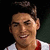 A pixelated image of a person in a white and red shirt with dark hair, displayed across multiple showing different facial expressions