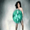 A woman in a light blue dress holds a large green balloon, transitioning through various poses against a gradient background.