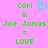 Green pixelated text on pink background reads 'Cori & Joe Jonas = LOVE' with a cyan heart symbol replacing the ampersand in one version.