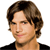 Pixelated portrait of a person with brown hair and a black top against a white background.