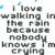 Pixelated text reads "I love walking in the rain because nobody knows I'm crying" with blue raindrops and white figures against a gray background.