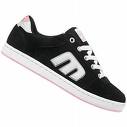 Black and white low-top sneaker with large stylized 'M' logo on side, white laces, pink accent on heel tab, isolated on transparent background.