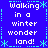 Blue background with white text reading "Walking in a winter wonder land!" repeated four times, framed by cyan snowflake and dotted-line borders.