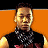 Pixelated image of a person with short dark hair wearing a black sleeveless top and a patterned neck accessory against an orange background.