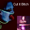 Blue-skinned figure with glowing green lines around mouth and neck, red eyes, tongue out; text "Cut it Bitch" above; three small inset images of a person at a keyboard under dark background.