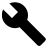 Black pixelated wrench icon on solid light gray background, rendered in low-resolution bitmap style with visible pixelation.