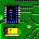 Green circuit board with blue integrated circuits, yellow and red components, and white connectors arranged in a dense pattern