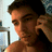 A pixelated image of a person holding a phone to their ear, with text overlays on a yellow background.
