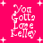 A bright pink background with white pixelated text reading "You Gotta Love Kelley" and scattered white plus signs in four quadrants.