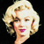 Pixelated close-up of a person with blonde hair, pink lips, and a dark background, rendered in a low-resolution style.