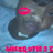 Animated icon of a cartoon character with dark skin and red lips, wearing a black cap, against a light blue background.