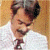 A pixelated image of a person in a white shirt and dark tie against a light brown background, with green text reading 'Original Icons .com' on the right side.