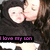 Two people in close physical proximity with one person kissing the other's cheek, set against a dark background with purple text overlay.