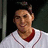 A person in a white baseball jersey with red trim stands against a dark background, with text overlay reading "Jacoby = My Love".
