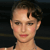 Pixelated close-up of a person with short dark hair, light skin, and red lips against a dark background.