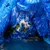 Pixelated blue-toned image with indistinct shapes and color gradients, lacking clear subjects or text.
