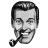 Pixelated grayscale image of a man's face with dark hair, mustache, and goatee holding a pipe in his mouth.