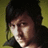 Pixelated image of a person with dark hair against a yellow background, with cyan text warning about a 'sexy vegan' on a black field.