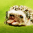 A small animated icon shows a cartoon hedgehog with spiky brown and white fur, dark eyes, and a pink nose against a green background.
