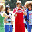 A pixelated image shows a group of people in two sections: upper section with individuals including one in red dress, lower section with five people posing together.