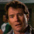 A split-screen image showing a pixelated character on the left and green text reading "Original Icons .com" on a dark green background on the right, with visible dithering and low-resolution artifacts.