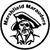 Black-and-white pixelated circular icon with a central figure wearing a wide-brimmed hat and holding a staff, surrounded by a thick border with partial text.