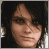 A contact sheet of 13 animated frames showing a pixelated black background with white text "GERARD WAY" and heart symbols, alongside one frame containing a partial portrait of a person with dark hair.