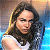 A split-frame contact sheet showing a pixelated image of a woman with long brown hair on the left and green text reading "Original Icons .com" on a dark green background on the right.