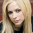 Pixelated image of a person with long blonde hair and blue eyes, accompanied by pink text on a black background.