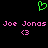 Green pixelated heart symbol above pink text reading 'Joe Jonas' repeated twice with pink '<3' symbols below each name on a black background.