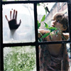 A four-panel grid shows a hand pressed against glass, a person holding green leaves, grass, and a person in a patterned top.