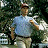 A pixelated image showing a person in motion on the left and bold text "RUN FORREST RUN!" on the right against a light blue background.