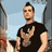 Pixelated image of a person with a mohawk hairstyle wearing a black t-shirt, standing next to blue text reading 'Johnny Christ' on a black background.