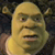 Pixelated close-up of a green-skinned ogre with a bald head, furrowed brows, and a slightly open mouth showing teeth, set against a dark background.