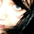 Pixelated close-up of a person's face showing eye, hair, and partial cheek with high-contrast lighting.