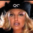 A split-screen image shows a person with blonde hair wearing a black cap with white text on the left, and the same person without the cap on the right, above green background text.