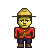 Pixel art of a figure in red tunic, dark blue trousers, brown boots, and tan wide-brimmed hat with black band.