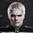 A static image of a person with short white hair wearing dark clothing, displayed in three showing different text overlays