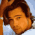 Static pixelated icon of a person with brown hair and light skin against a blue background, rendered in low-resolution style typical of early 2000s instant messaging platforms.