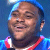 Static pixelated image of a smiling person wearing red and white clothing against blue background with light effects.