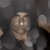 Static pixelated image of a light-colored, rounded object with a smooth surface against a dark background.