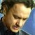 Pixelated close-up of a person's face with light skin tone, dark hair, and closed eyes against a blue background.