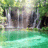 Pixelated waterfall scene with green foliage and turquoise water, featuring a white text overlay reading 'Kate' in the upper right.